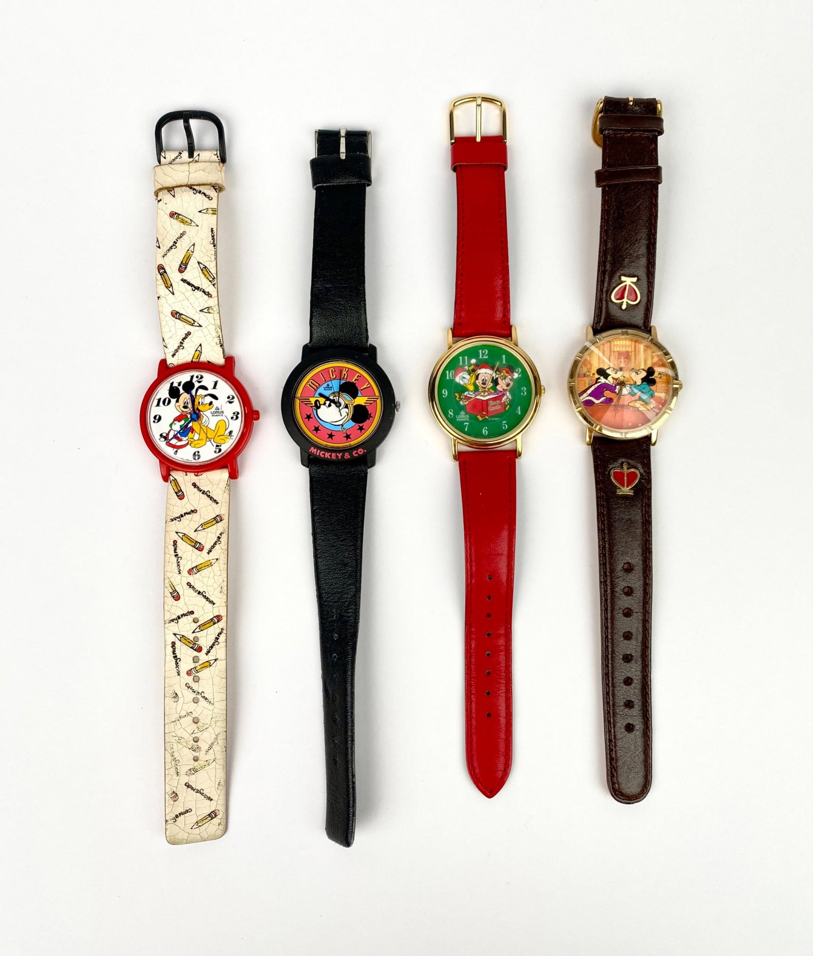 Four Disney quartz wristwatches featuring Mickey Mouse and Friends motifs. Includes a variety of: Four Disney quartz wristwatches featuring Mickey Mouse and Friends motifs. Includes a variety of designs, such as Mickey with Pluto, a Christmas carol scene with Mickey, Minnie, and Donald Duck, and m