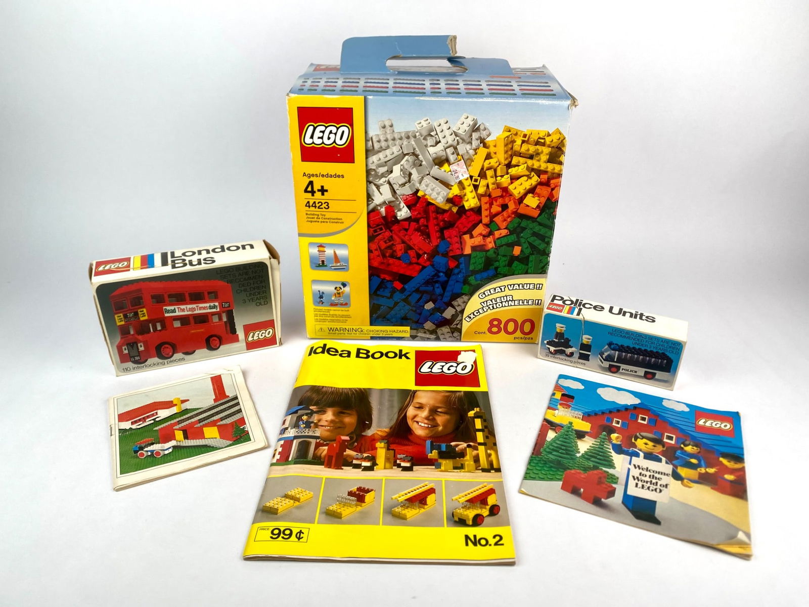 Lot features a collection of vintage LEGO items, including the 1975 LEGO set 760 London Bus with (1 of 7)