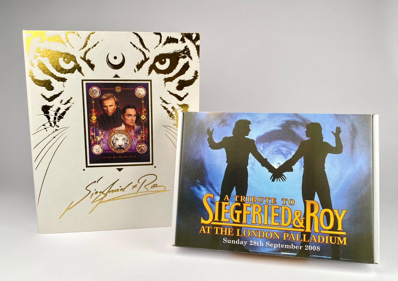 Siegfried & Roy ‘Unique in All the World’ Limited Tribute Collection with Signed Limited Edition: A collectible set dedicated to Siegfried & Roy, including a signed book titled “Unique in All the World” (Noesis Publishing, No. 81/500) with signatures by Roy Horn and Siegfried Fischbacher.