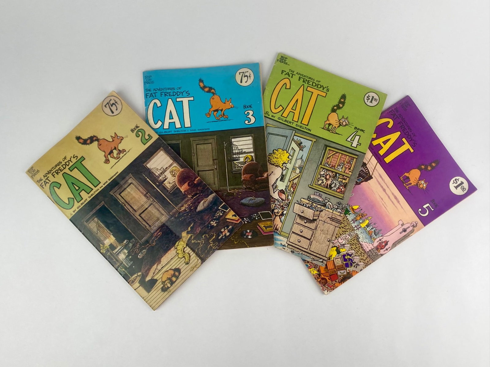 Group of four underground comix titled "The Adventures of Fat Freddy's Cat," including Books 2,3,4,: Group of four underground comix titled "The Adventures of Fat Freddy's Cat," including Books 2,3,4, and 5, published by Rip Off Press and created by Gilbert Shelton with contributions by Dave Sheridan