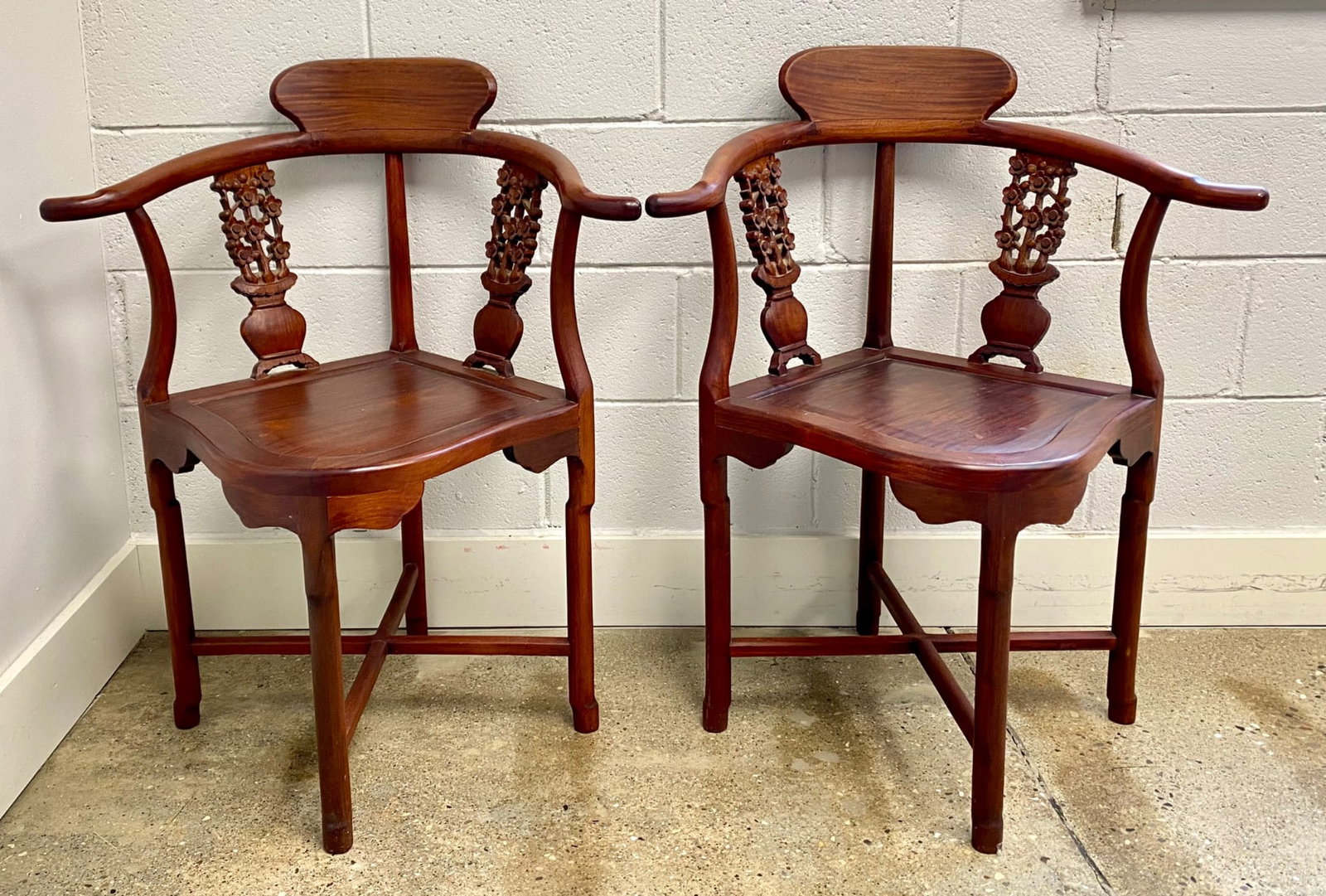 Pair of Chinese rosewood armchairs featuring carved floral vase motifs on the backrests. Each chair (1 of 11)