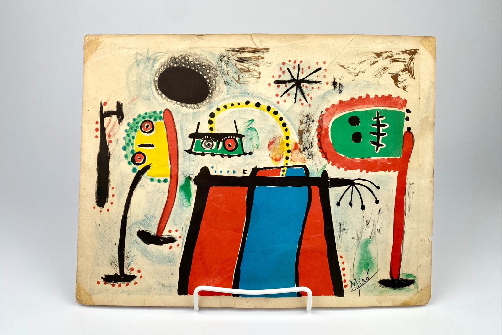 Joan Miro Style Abstract Mixed Media Painting on Paper, Signed ‘Miro’: Abstract artwork rendered on paper using mixed media, including vivid colors and dynamic shapes signed 'Miro'. The piece captures detailed elements of abstract figures and patterns. The painting shows