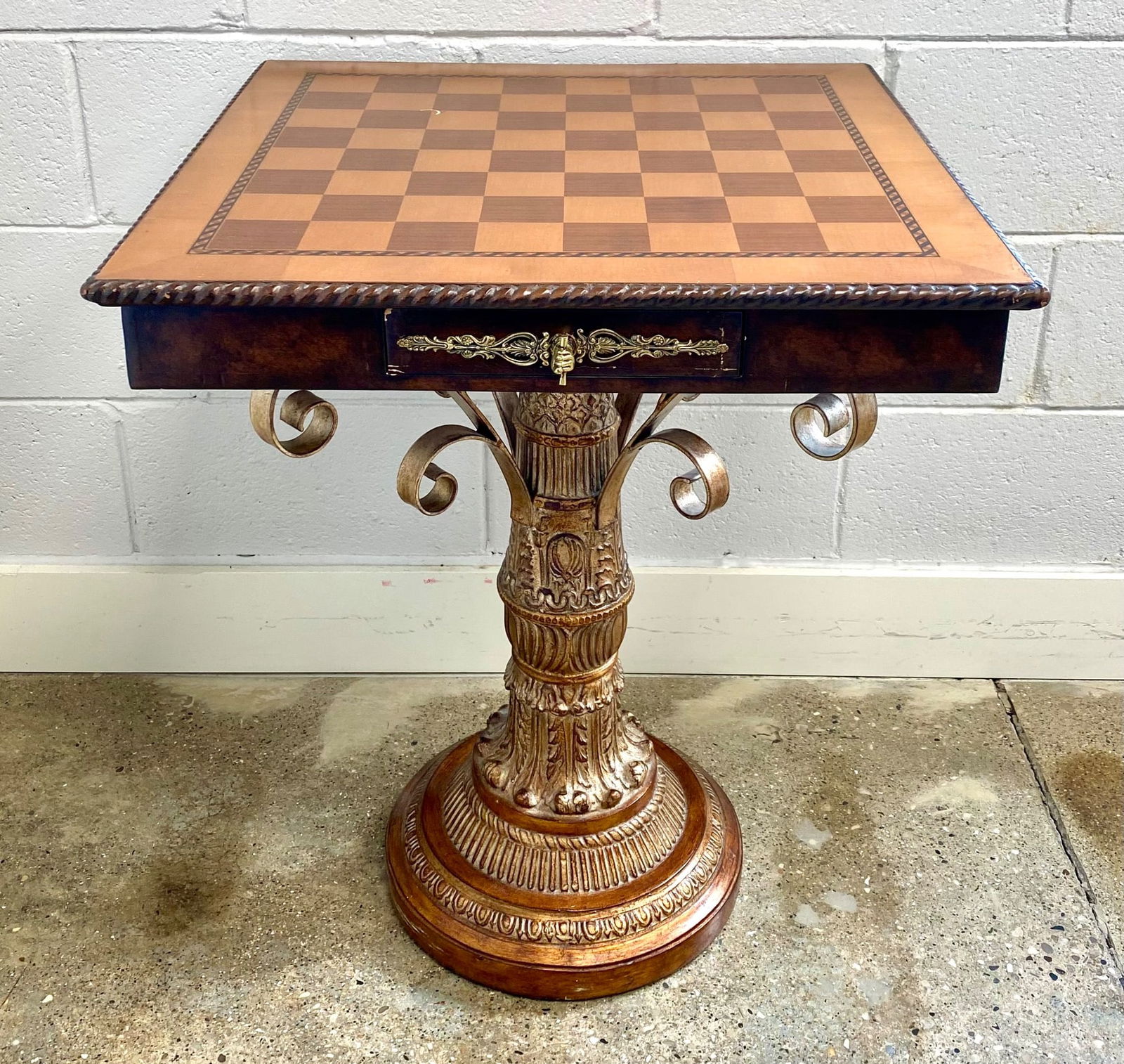 Neoclassical style chess table featuring a wooden checkered top with decorative inlay and a carved (1 of 12)