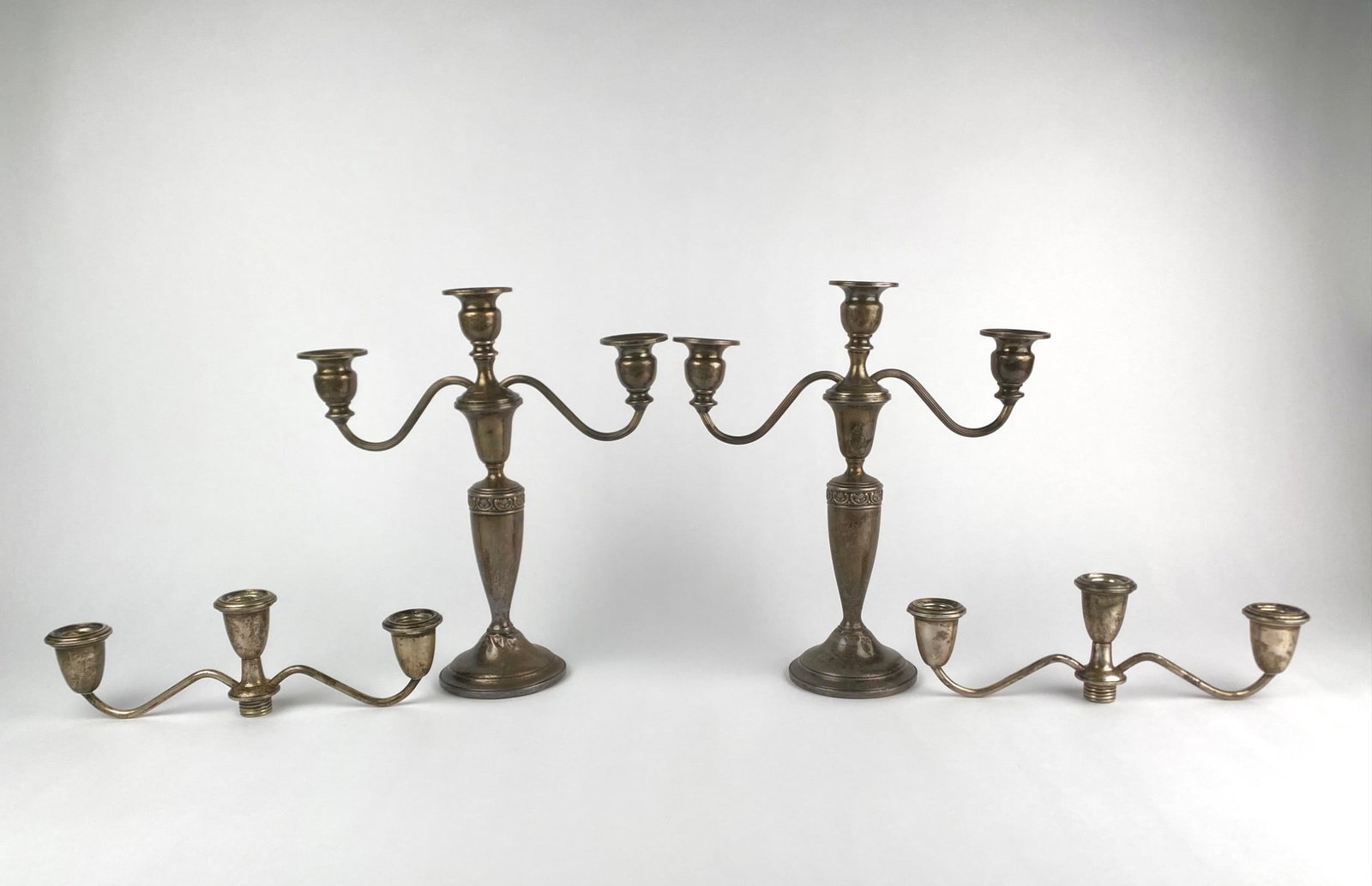 Lot includes a vintage four-piece silverplate candelabra set consisting of a pair of convertible (1 of 12)