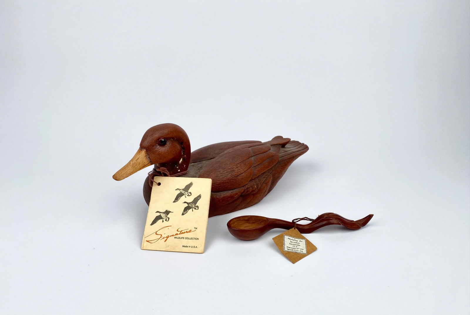 Handcrafted Hen Mallard collectible created from an original sculpture by Don Eisenschenk. Marked: Handcrafted Hen Mallard collectible created from an original sculpture by Don Eisenschenk. Marked “Signature Mfg., Minneapolis, MN” on the underside brass plaque, dated 1983. Includes original