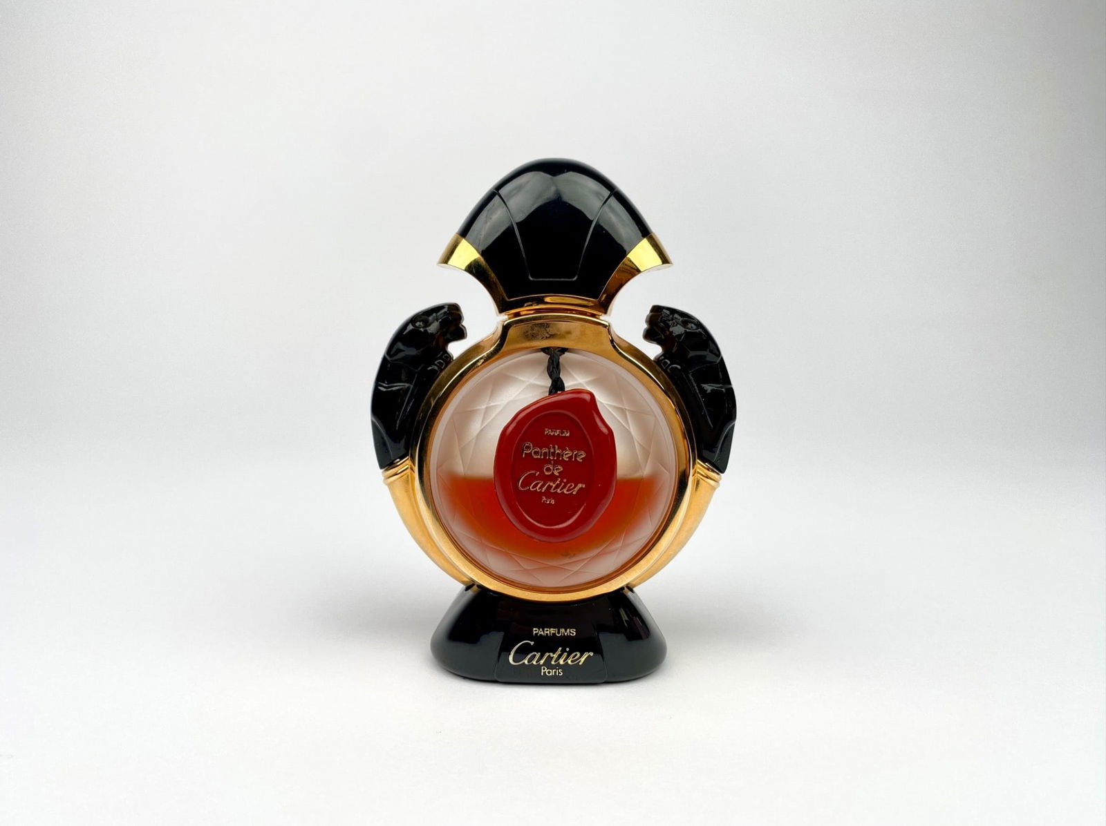 Panthere de Cartier perfume bottle featuring a black and gold panther motif. This elegant glass (1 of 8)