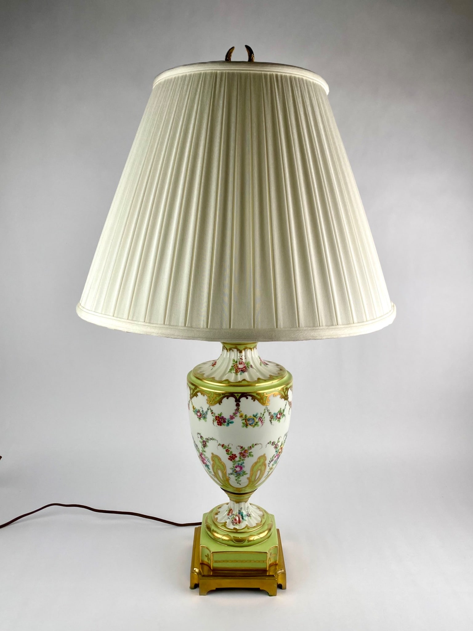 French-style porcelain urn-form table lamp featuring a celadon green ground with extensive gilt (1 of 11)