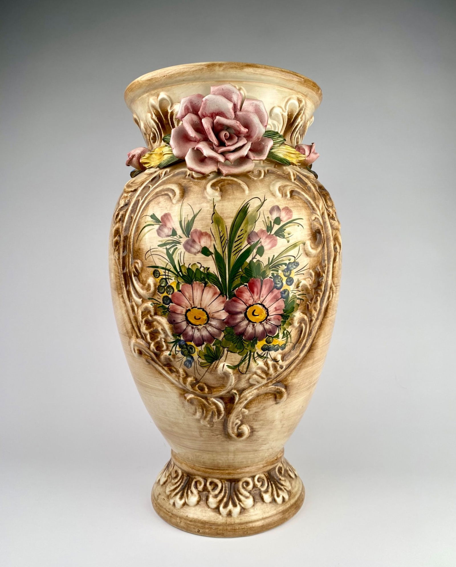 Hand-painted porcelain vase featuring intricate floral details and embossed decorative motifs, (1 of 12)