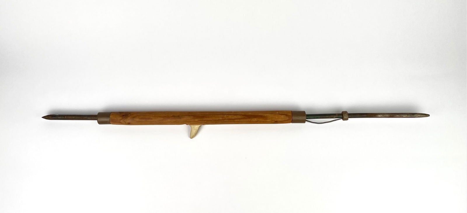 Inuit hunting harpoon featuring a smooth wooden handle, a metal-tipped point, and a functional lever (1 of 8)