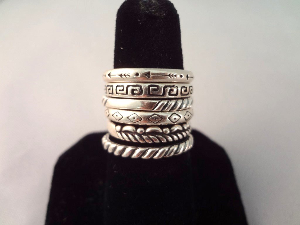 (6) Carolyn Pollack Southwest Sterling Silver Stackable: (6) Carolyn Pollack Southwest Sterling Silver Stackable Rings: Stamped southwestern motif stackable rings sizes range from 6.5-8. Hallmarked with Carolyn Pollack's Old Carlisle of Albuquerque, NM. Tot