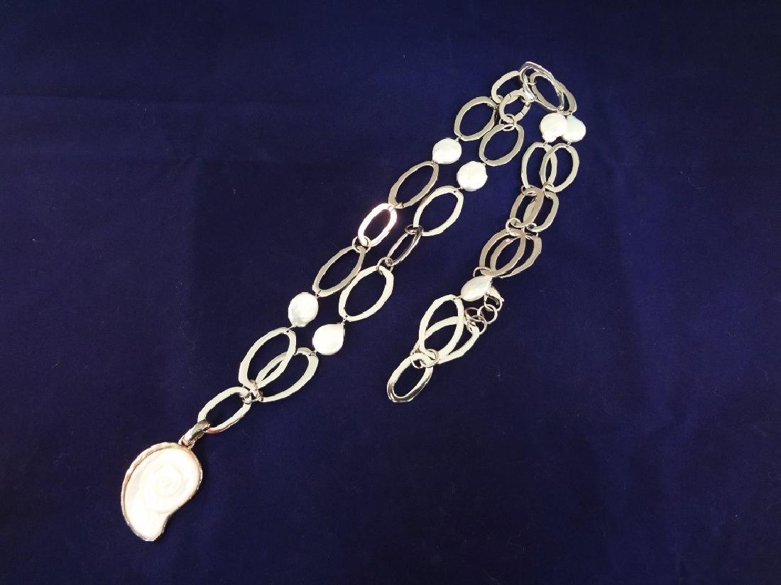 Robert Lee Morris Sterling Silver Necklace Nautilus: Robert Lee Morris Sterling Silver Necklace Nautilus Shell Pendant: 36" long Sterling Necklace large oval links and mother of pearl spacers. Pendant is a nautilus shell silver wrapped pendant 1.75" lon