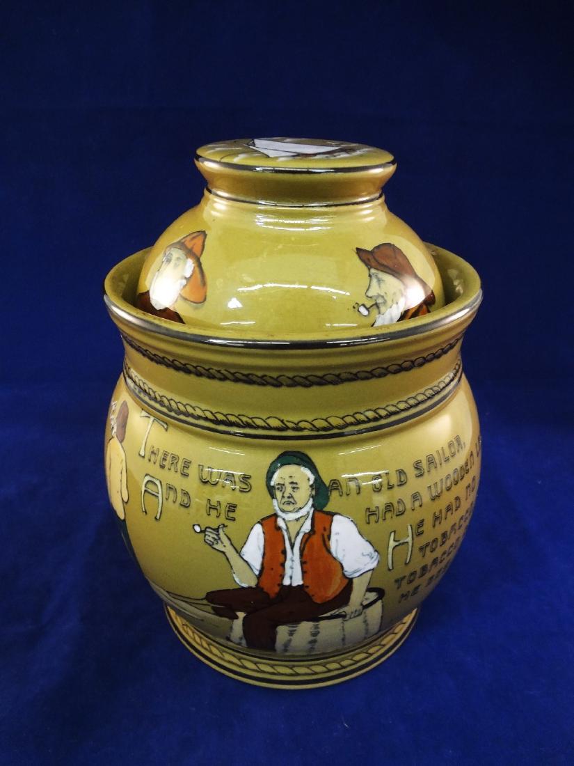 Deldare Buffalo Pottery Humidor: Deldare Buffalo Pottery Humidor: Lidded and with no condition issues. Measures 7.5" tall. Reads "There was an old sailor and he had a wooden leg. He had no tobacco, nor tobacco would he beg. So save u