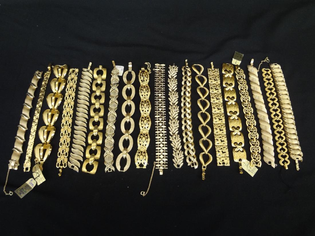 (20) Trifari Costume Gold Tone Jewelry Bracelets with: (20) Trifari Costume Gold Tone Jewelry Bracelets with Original Tags: Many with original tags, all in gold tone.