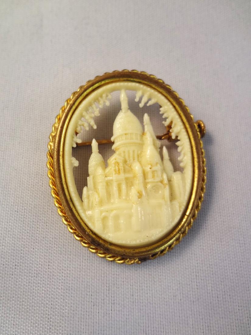 Victorian Carved Relief Church Shell Cameo: Victorian Carved Relief Church Shell Cameo: Lovely relief carved cameo featuring a church. Gold filled setting and measuring 1.5 x 1.25".