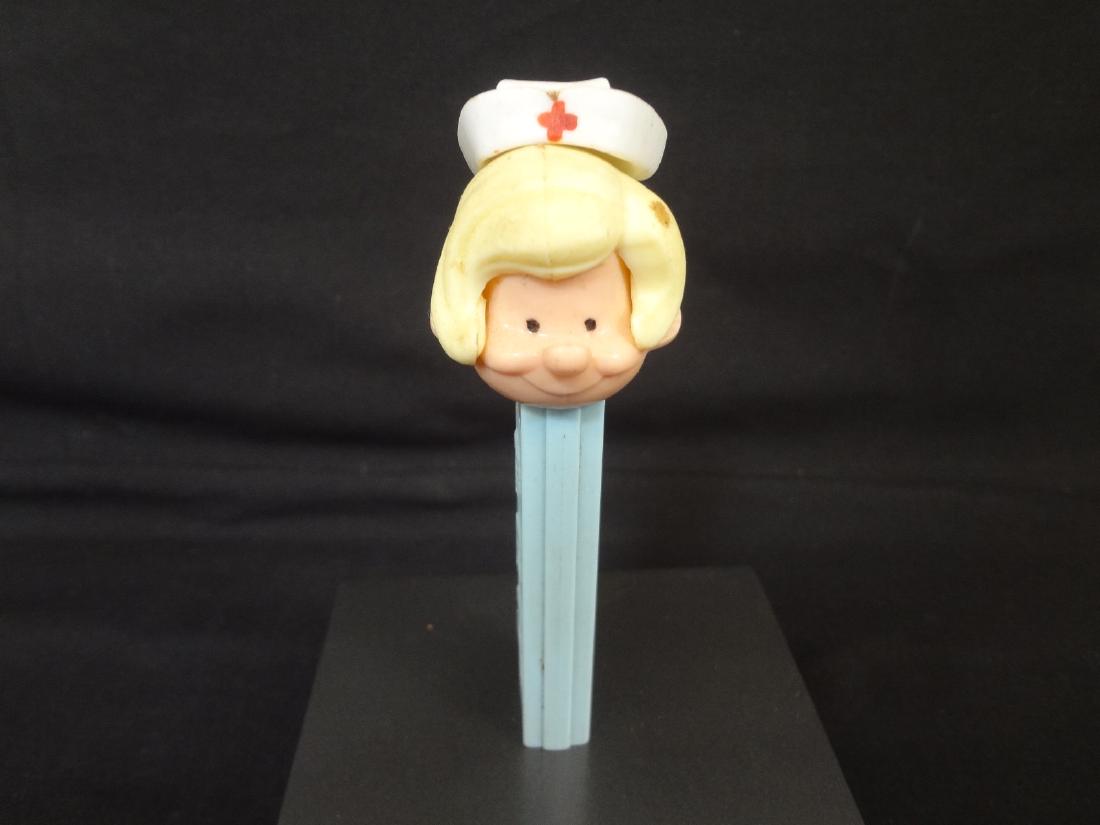 Pez Dispenser No Feet Nurse Patent number 3.8 Made in: Pez Dispenser No Feet Nurse Patent number 3.8 Made in USA: In excellent condition.
