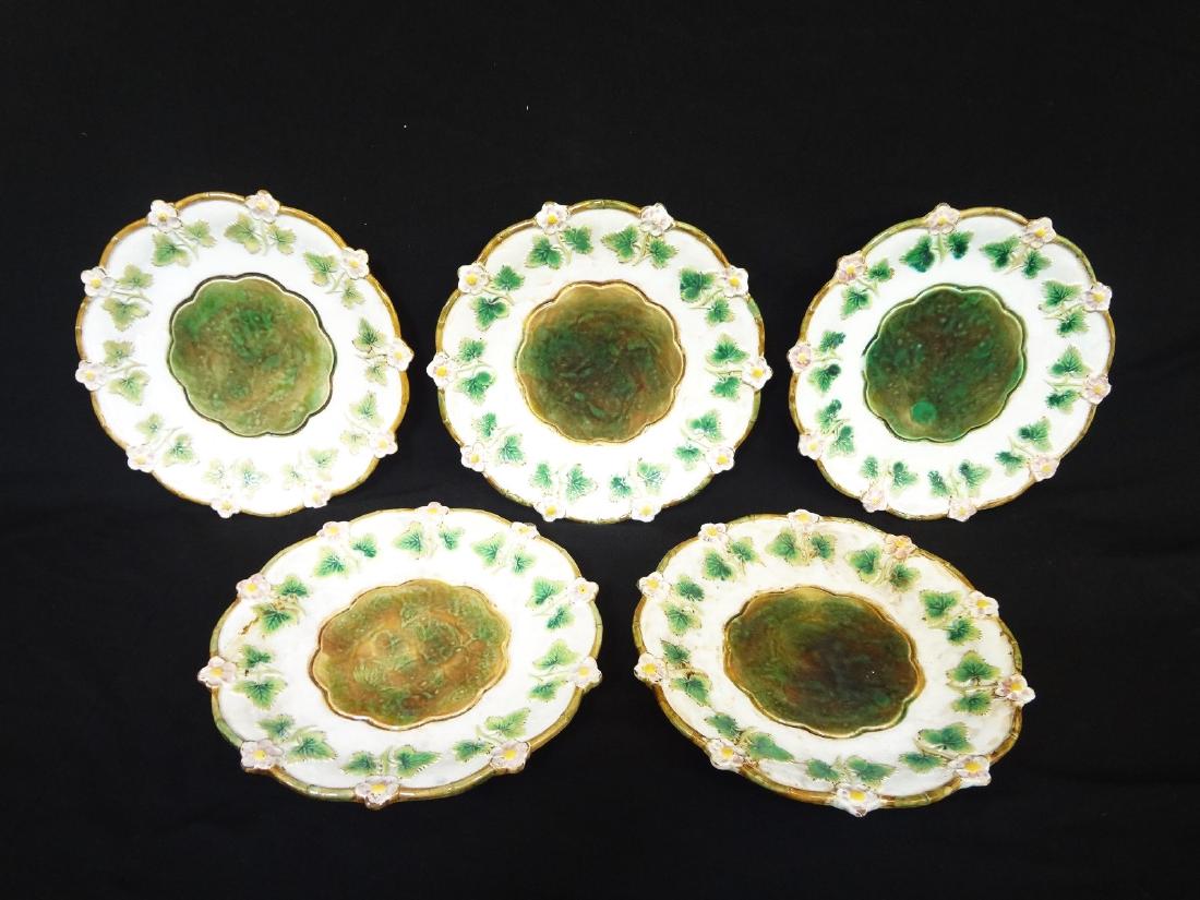 (5) George Jones Majolica Strawberry Blossom Plates: (5) George Jones Majolica Strawberry Blossom Plates: Incredible group of 5 George Jones plates with strawberry floral motif and mottled centers. Plates measure 8.25" in diameter. Crazing throughout bu