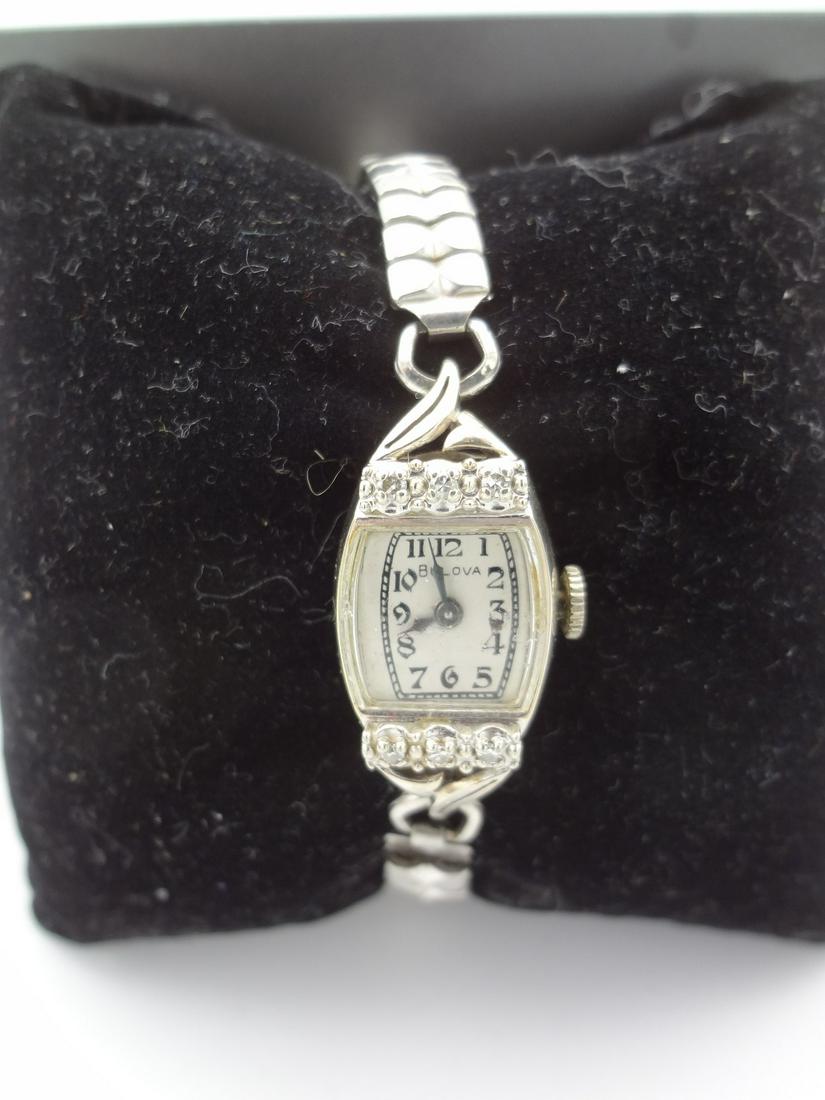 14k Gold Bulova Ladies Watch With (6) Diamond Chips: 14k Gold Bulova Ladies Watch With (6) Diamond Chips: 17 jewels case number 7658843.