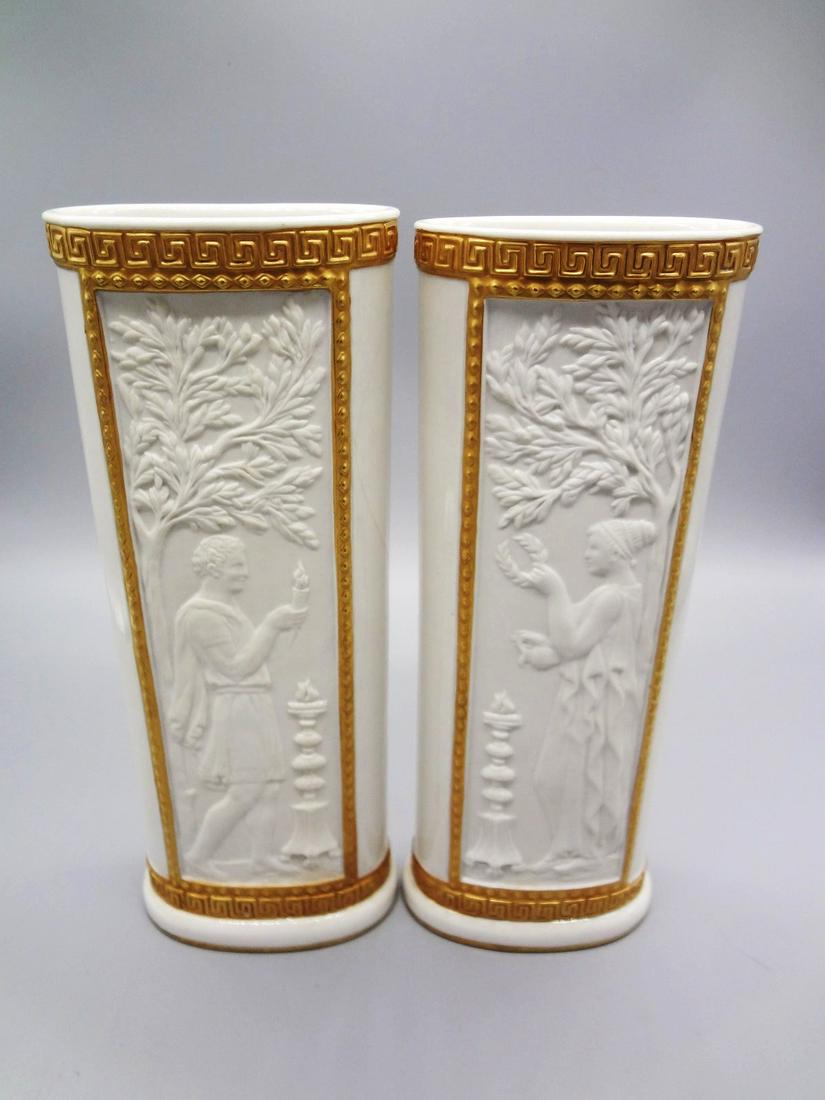 Pair Mottahedeh Neoclassical Vases: Pair Mottahedeh Neoclassical Vases: Measuring 9.5" tall, 3.5 x 2" top. White matte porcelain with gold edge. One vase has hairline crack on side. Marked on bottom with original paper label.
