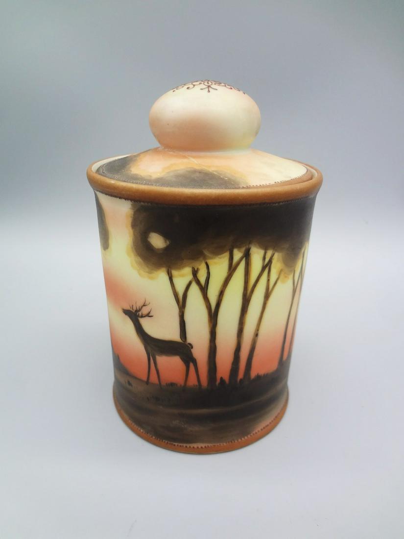 Nippon Hand Painted Lidded Tea Caddy: Nippon Hand Painted Lidded Tea Caddy: Measures 5.5" tall with a repair to the lid.