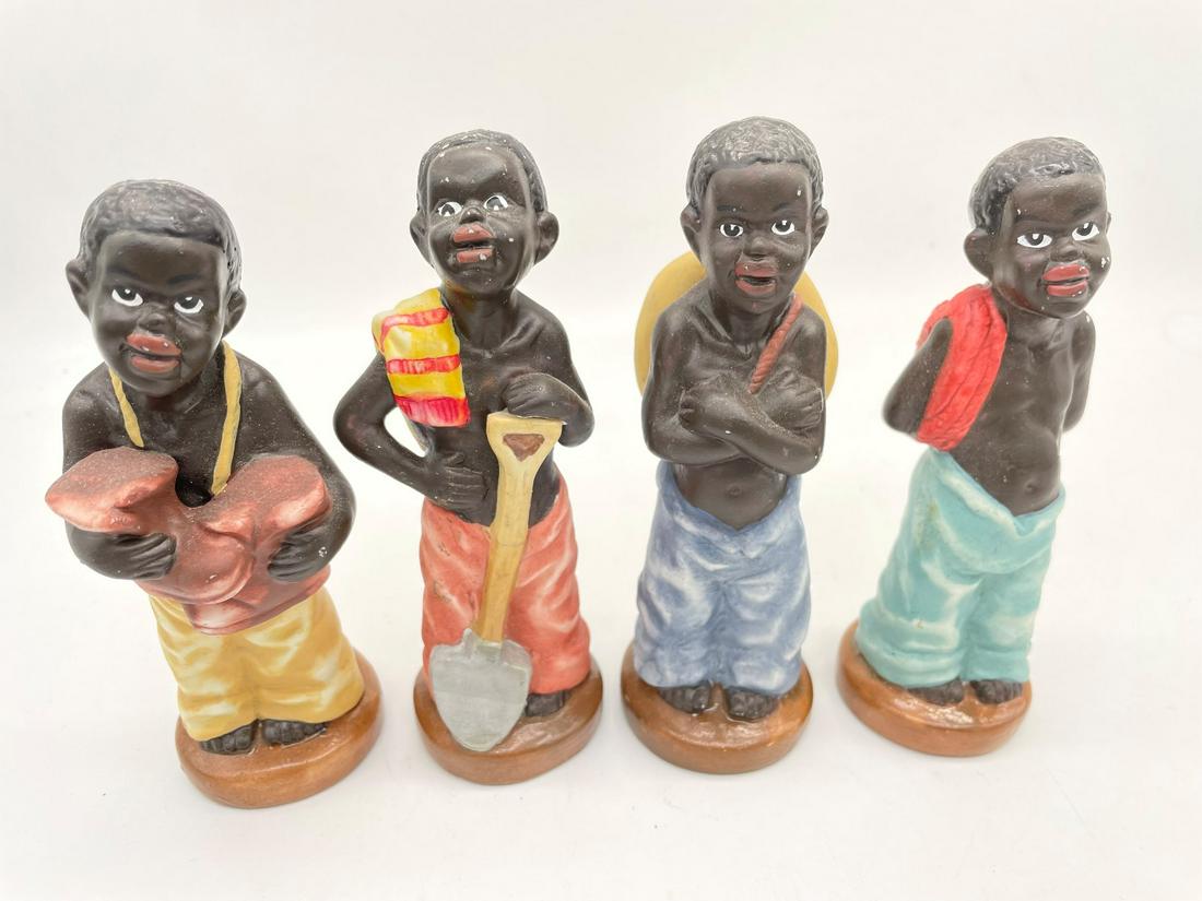 (4) Black Americana Porcelain Boys: (4) Black Americana Porcelain Boys: Measuring 5.75" tall, one with shovel, rope, hat, and boots. No condition issues