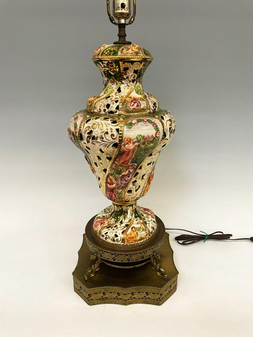 Capodimonte Italian Porcelain Raised Relief Lamp: Capodimonte Italian Porcelain Raised Relief Lamp: Stunning high relief Capodimonte lamp with ladies and floral detail. No chips, cracks or repairs. Sits on brass base, and measures 37" tall to finial.