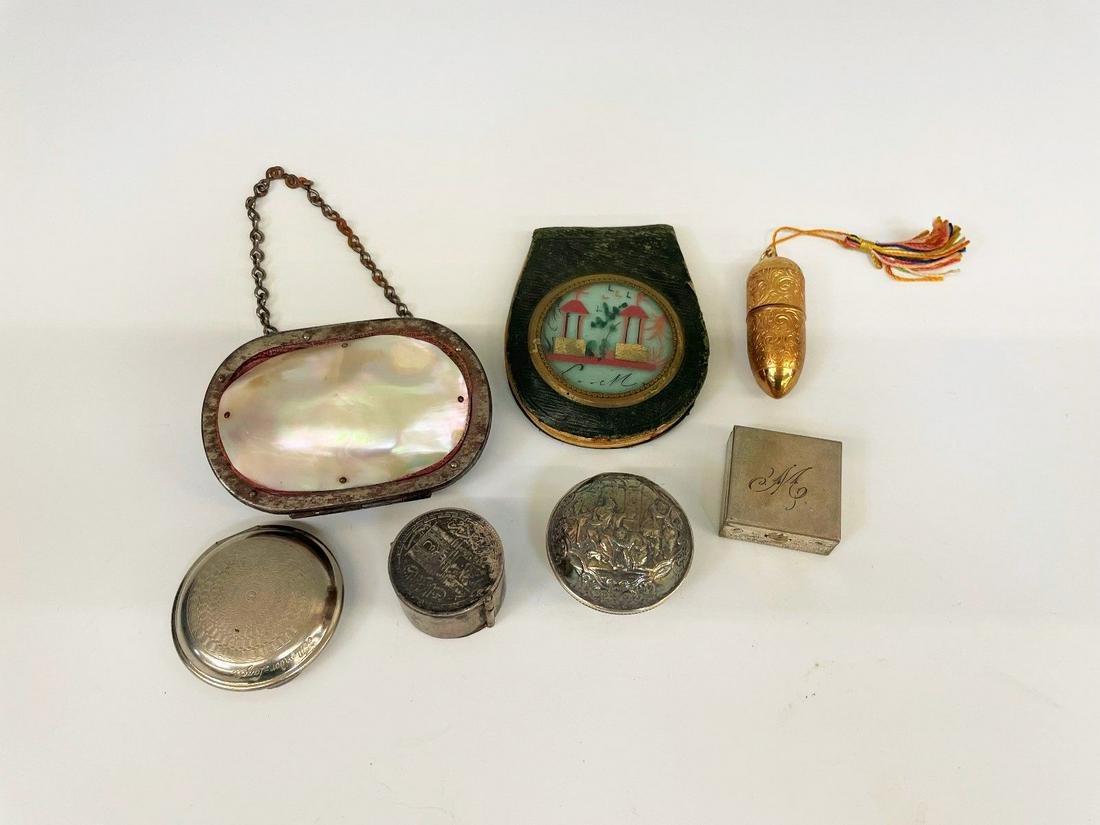 (7) Small Boxes: Stamp Holder, Pill Tin, Needle Case, Change Purse: (7) Small Boxes: Stamp Holder, Pill Tin, Needle Case, Change Purse: 1 compact deMeridor Lazell, 1 stamp holder possibly Egyptian, 1 pill box with art nouveau design, 1 pill box letter "m", mother of p