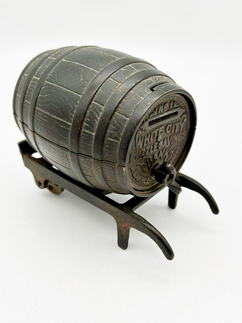 White City #1 Barrel on Cart Cast Iron Still Bank 1894: White City #1 Barrel on Cart Cast Iron Still Bank 1894: Rare bank made by Nicol and Co. from 1894. Puzzle Savings Barrel of Money. 4.25" tall, 5" long in excellent condition