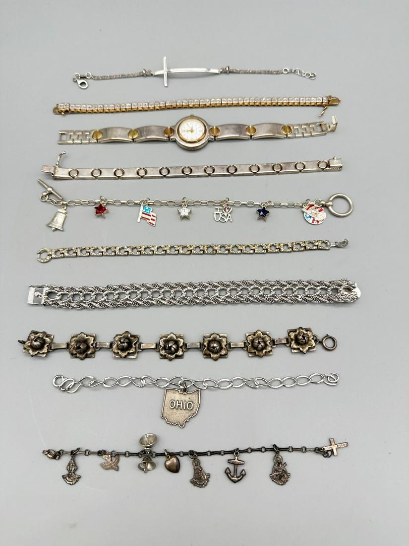 (10) Sterling Silver Bracelets: Enamel, Charms: (10) Sterling Silver Bracelets: Enamel, Charms: Includes 3 charm bracelets, Ecclissi watch bracelet set, and 5 others.