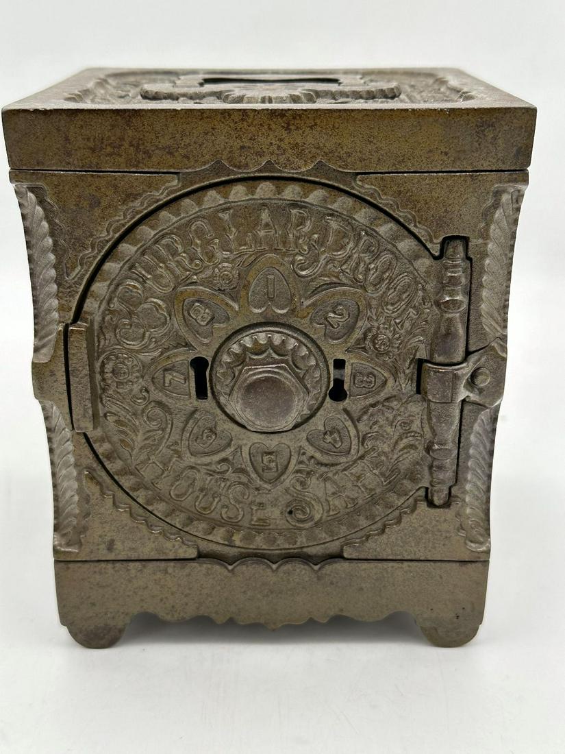 1897 J.E. Stevens Cast Iron Burglar Proof House Combination Safe: 1897 J.E. Stevens Cast Iron Burglar Proof House Combination Safe: Measures 6" tall.