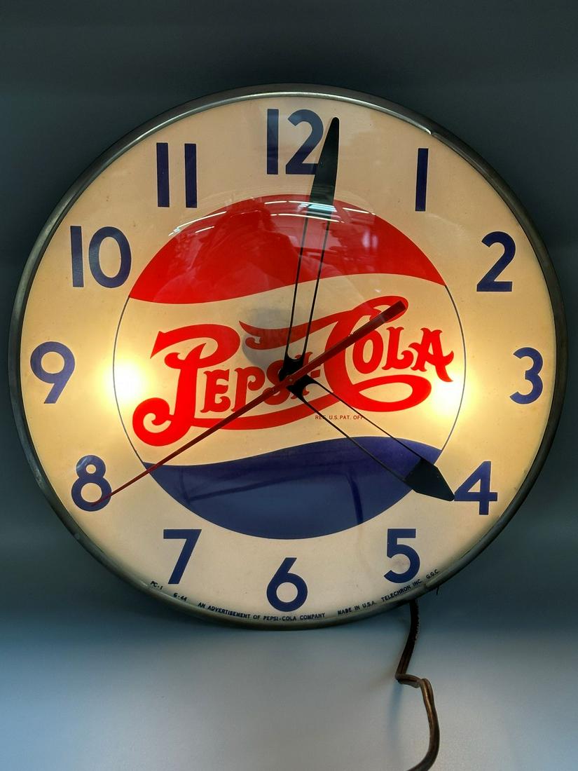 Pepsi-Cola Round Bubble Glass Double Dot Light up Clock: Pepsi-Cola Round Bubble Glass Light up Clock: Made by Telechron Electric Clock Co. for Pepsi-Cola. Some wear on reverse metal housing. Face marked PC-1 G-44. An advertisement of Pepsi-Cola Co. Measure