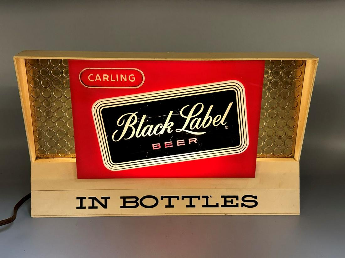 Carling Black Label Beer in Bottles Advertising Display Light Up Sign: Carling Black Label Beer in Bottles Advertising Display Light Up Sign: Made by Dimensional Products. In working condition. Plastic housing front. Measures 11.5" long, 7" tall, 4.75" deep. This item re