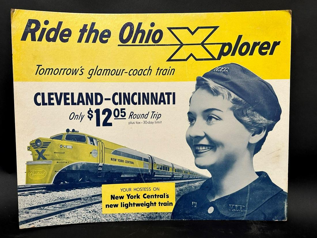 Ride the Ohio Xplorer Coach Train Cardboard Advertising Sign: Ride the Ohio Xplorer Coach Train Cardboard Advertising Sign: Easel piece missing from reverse. Cleveland to Cincinnati 12.05 Round Trip. Your Hostess on NY Central's New Lightweight Train. Measures 2
