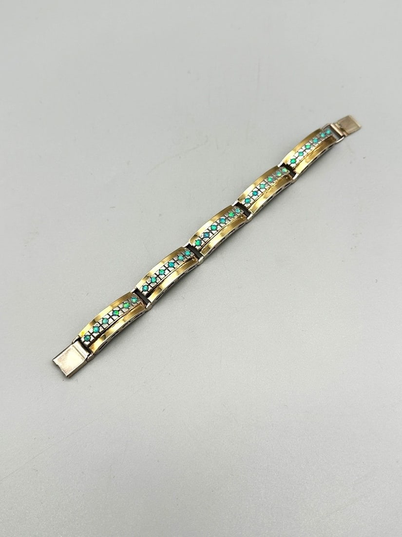 Sterling Silver and Opal Bracelet: Sterling Silver and Opal Bracelet: 5 links, 6 opals in each. Measures 6.75" long.