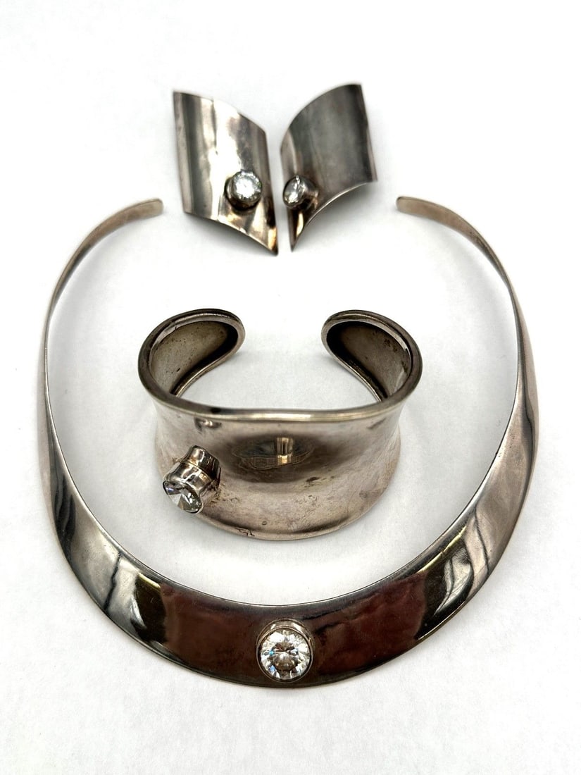 Mexico Sterling Silver Jewelry Suite: Mexico Sterling Silver Jewelry Suite: Includes choker 5" top to bottom, cuff bracelet 2.25" diameter, earrings 2.5" long. All with rhinestone accents.