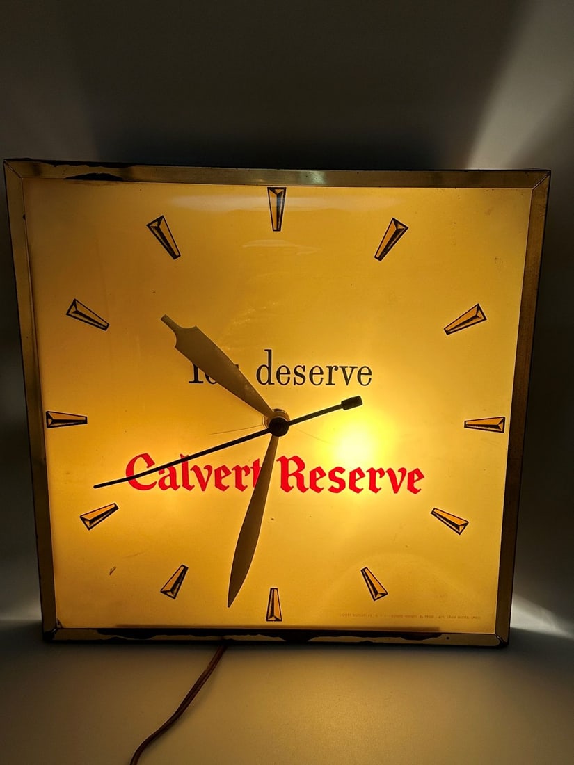 Calvert Reserve Whiskey Square Bubble Light Up Advertising Clock: Calvert Reserve Whiskey Square Bubble Light Up Advertising Clock: Gold square light up clock in working condition. Gold face has small crack. Metal housing has wear on edges. Measures 13" square 3.25"