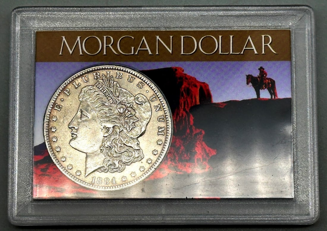 1884-O Morgan Silver Dollar: 1884-O Morgan Silver Dollar is encased in lucite and is from H.E. Harris Co.