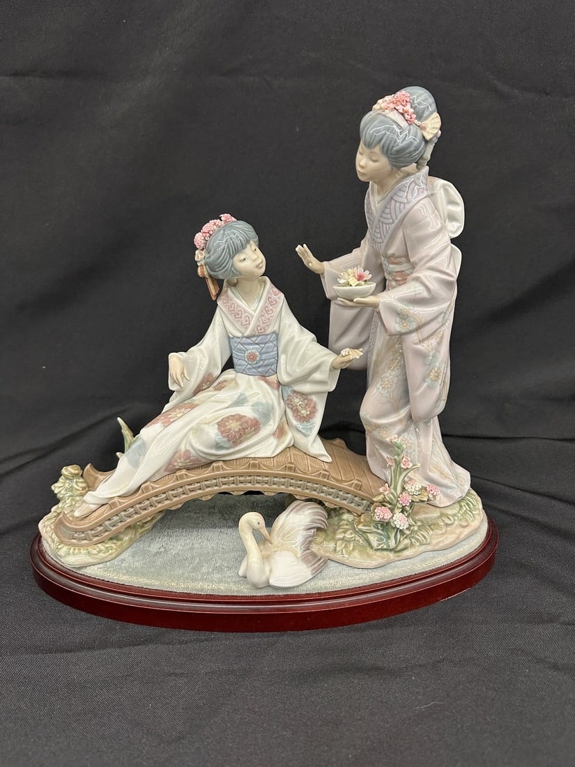 Lladro Kiyoko Springtime in Japan #1445 Figural Group: Lladro Kiyoko Springtime in Japan #1445 Figural Group: Missing umbrella. Measures 11.75" tall 13.5" long. 1983 Salvador Debon.