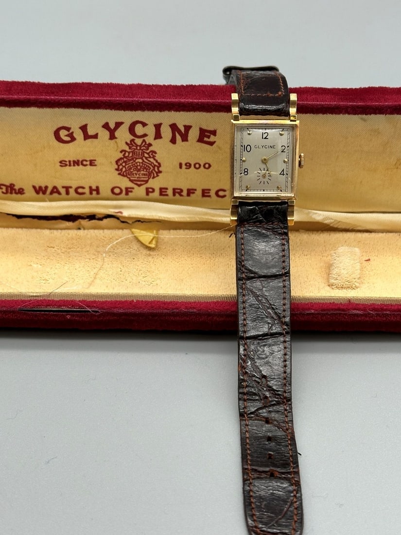 1950 Glycine 14k Gold Watch With Original Box: 1950 Glycine 14k Gold Watch With Original Box. Personalized on back "To Jack With Love Ruth 1950". Leather band and original box.