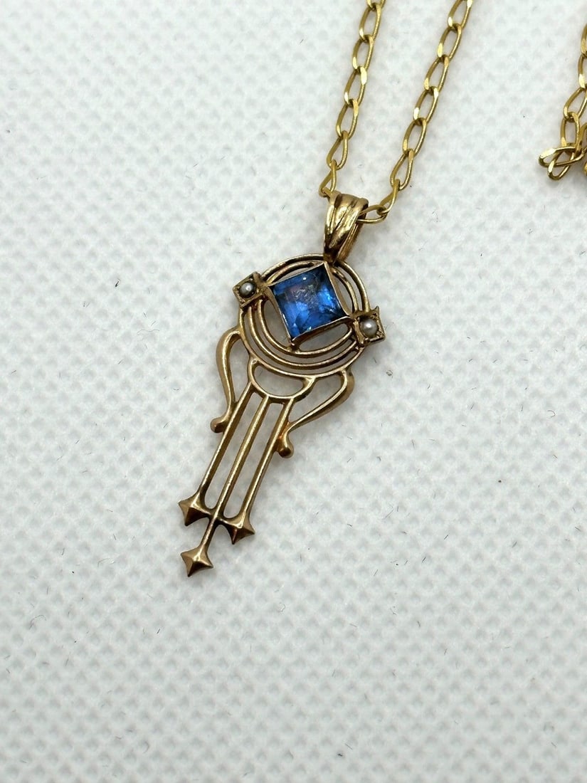 14k Yellow Necklace with Victorian Drop Dangle Pendant: 14k Yellow Necklace with Victorian Drop Dangle Pendant: Pendant includes seed pearls and blue gemstone. Necklace measures 18". Weight is 3.5 grams.