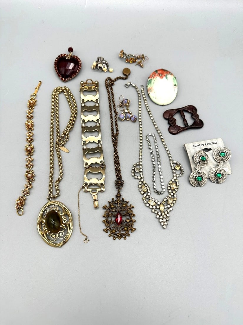 Group of Vintage Costume Jewelry: Group of Vintage Costume Jewelry: (4) pairs of earrings, buckle for shoe, 1 pendant, 1 brooch, 3 bracelets, 3 necklaces.