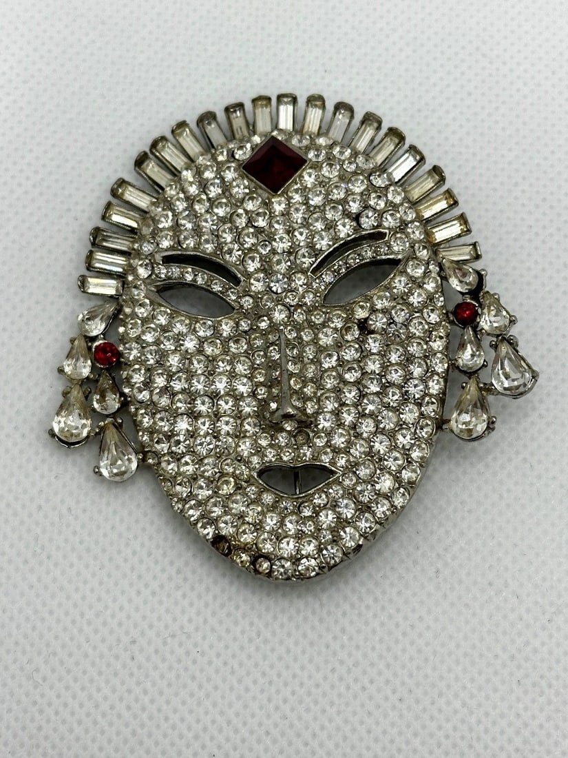 Butler Wilson Mask Brooch With Clear and Red Rhinestones: Butler Wilson Mask Brooch With Clear and Red Rhinestones: Measuring 2.5" long.