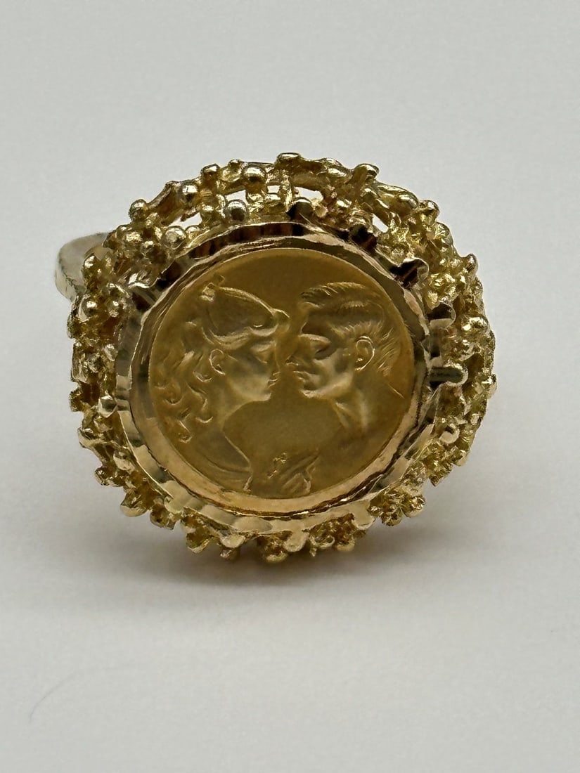 14k Yellow Gold Nugget Wedding Ring: 14k Yellow Gold Nugget Wedding Ring: With disc picture of man and woman. Back of ring reads Nuestra Amor Siempre. Size 5.75. Weight is 4.8 grams.