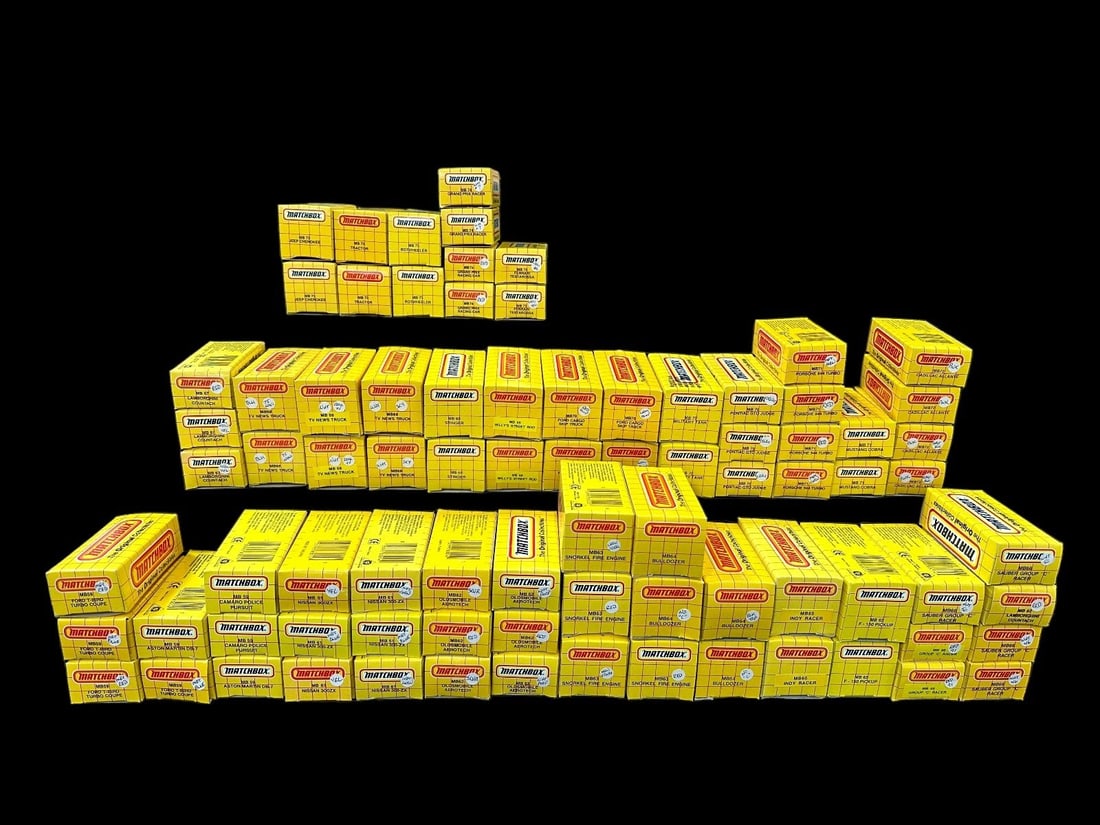 (83) Matchbox Cars 1989-1990's in Original Yellow Grid Boxes: (83) Matchbox Cars 1989-1990's in Original Yellow Grid Boxes: All cars in mint state. Please see pictures to see cars, variations and colors included in this lot.