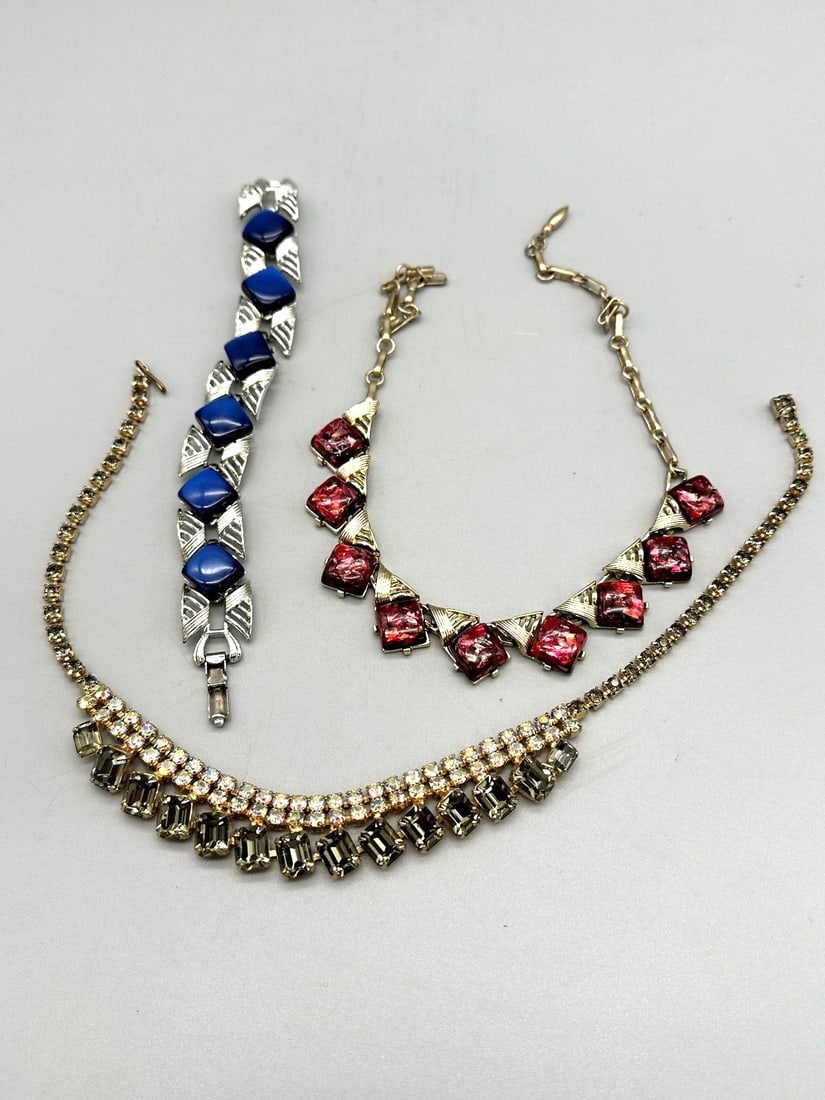 Group of Coro Jewelry: Group of Coro Jewelry: Necklace and bracelet in blue and red. Unnamed necklace with rhinestones.