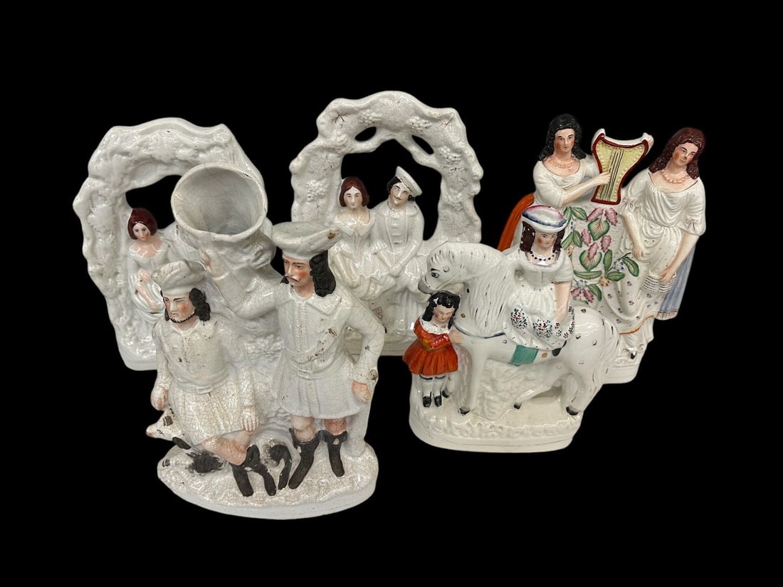 (5) Staffordshire Figurines: (5) Staffordshire Figurines: Includes (2) wedding couples 14.5 and 13.25". Bride on horse 12.75", 2 women with harps 14". 2 men with dog 15.25".