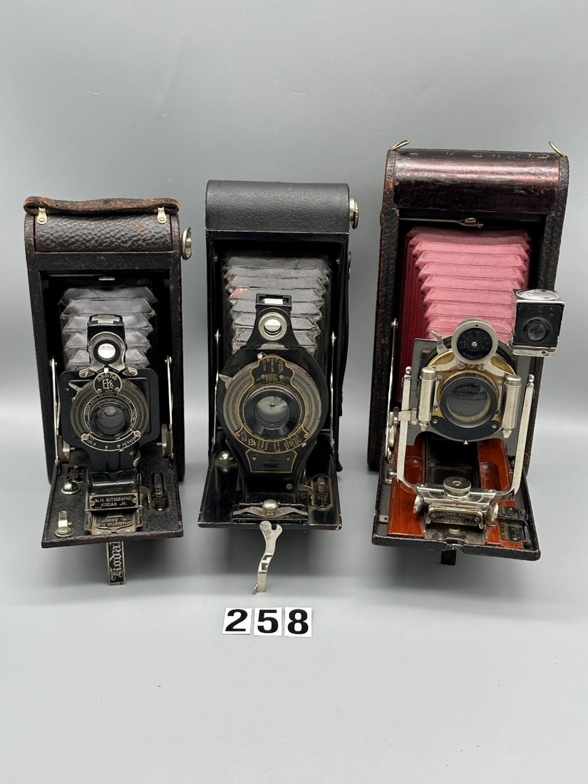 (3) Vintage Kodak Folding Cameras; Red and Black Bellows: (3) Vintage Kodak Folding Cameras; Red and Black Bellows: I. Folding Pocket Kodak No. 3A Model B-4. The red bellows are soft and supple and free of pinholes. The shutter speeds and f. stops work as th