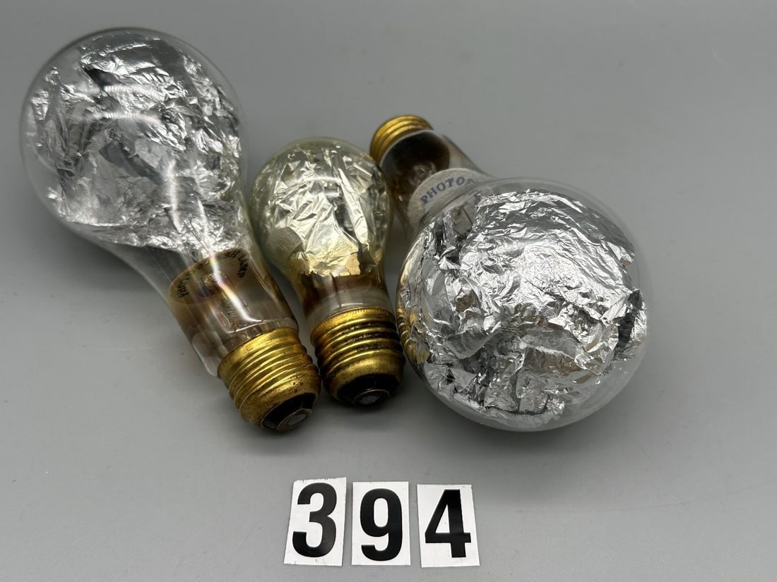 (3) 1930's Foil Filled Photoflash Lamps (Bulbs): (3) 1930's Foil Filled Photoflash Lamps (Bulbs): This lot includes three rare and sought after foil filled photoflash lamps from the 1930's, a great addition to any collection of photographica. (2) GE