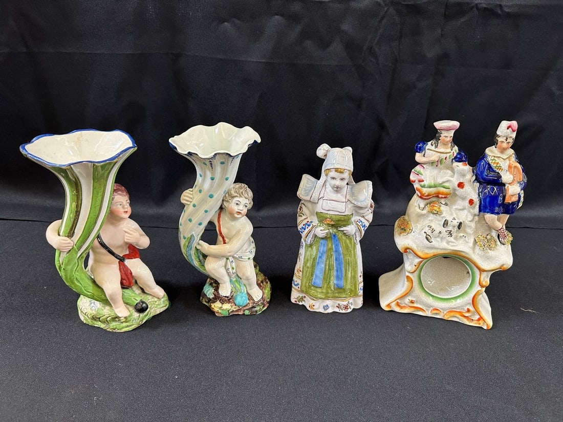 (4) Pieces English and French Porcelain: (4) Pieces English and French Porcelain: Staffordshire clock case has been repaired. French lady bell. 2 cupid bud vases.