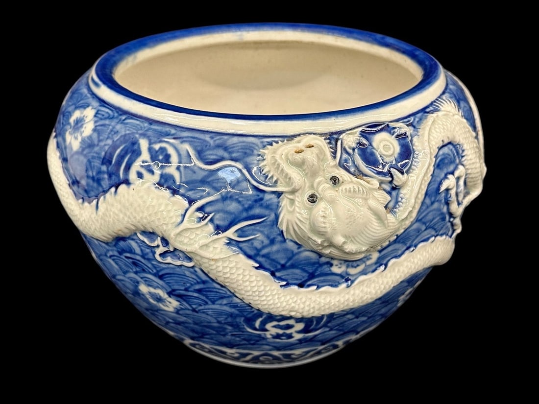 Chinese Blue and White Jardiniere: Chinese Blue and White Jardiniere: Dragon relief, measures 7.75" tall, 8" in diameter.