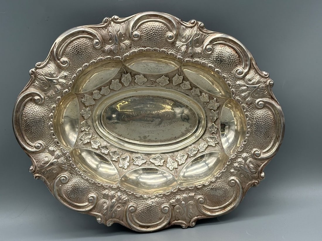 Sterling Silver Center Display Bowl by Alexander Clark London: Sterling Silver Center Display Bowl by Alexander Clark London: Stunning center display bowl high detail with vines. Inscription on bowl. Total weight is 562 grams. Measures 2.25" tall, 13 x 10.5".